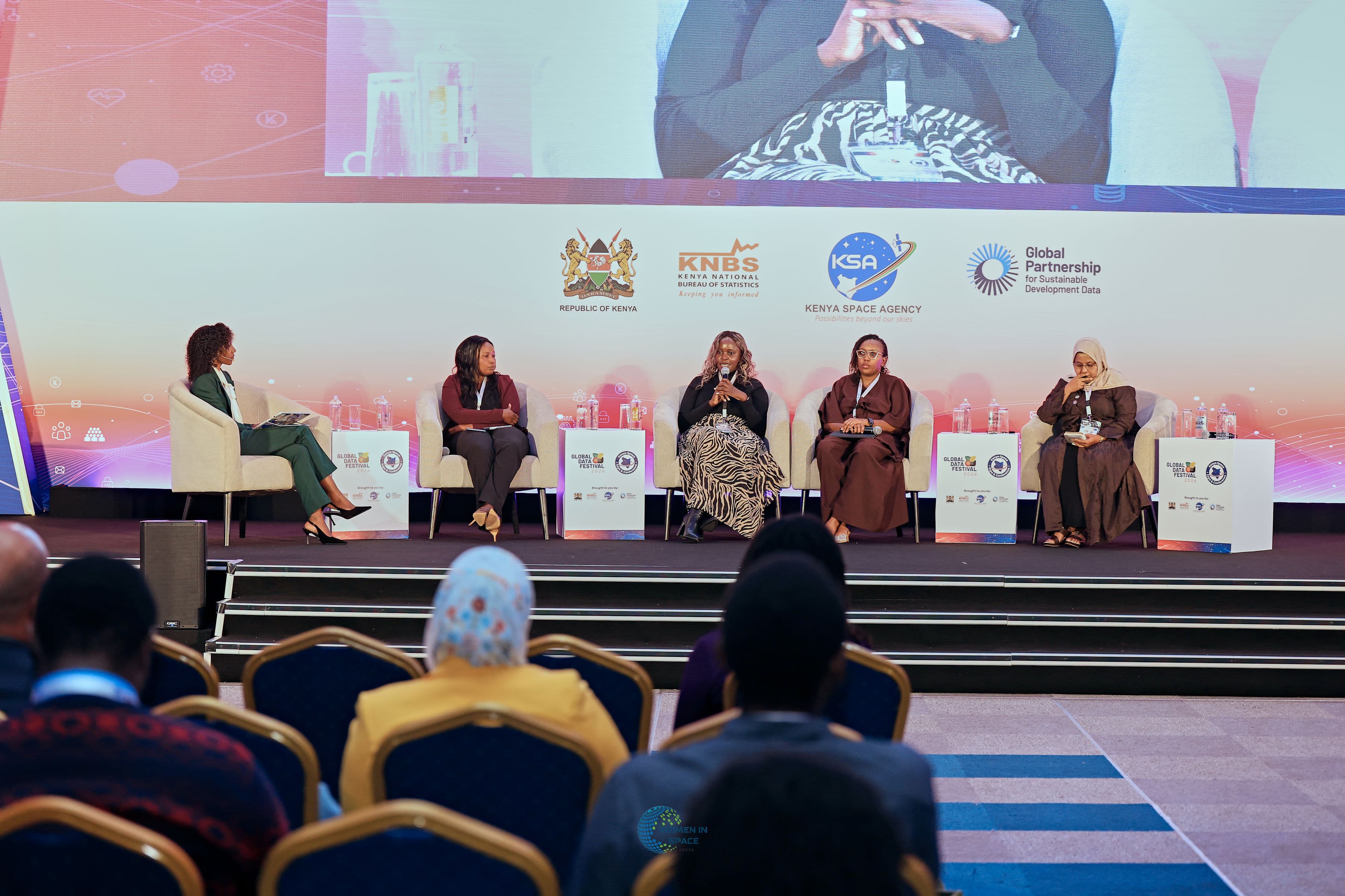 Speakers on stage at an AWIS event